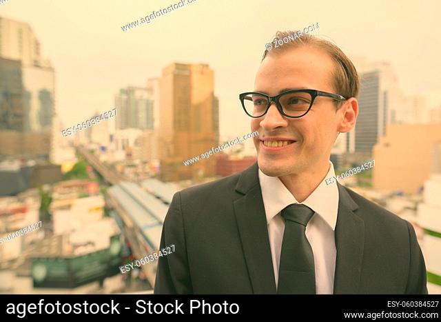 Portrait of young businessman exploring the city of Bangkok, Thailand
