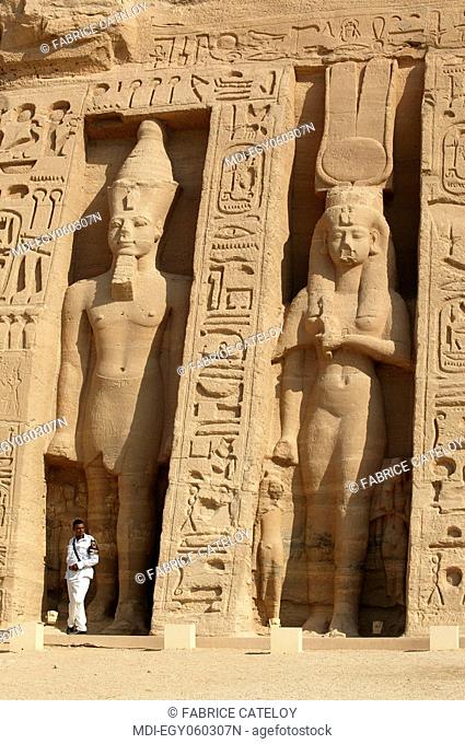 The Temple of Nefertari dedicated to Hathor - Policeman at the foot of the statues of Ramesses II and Nefertari on the frontage of the temple