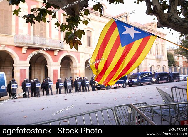 Catalan Pro-independent flag, called estelada, waving infront of the catalan parliament during a demonstration