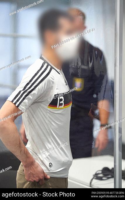 09 September 2020, Hessen, Limburg: The 33-year-old defendant is standing in the courtroom provisionally set up in a marquee before the start of the trial