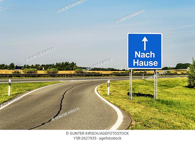 Road Sign with the German title Nach Hause (home) on the German Highway (Autobahn), Germany, Europe