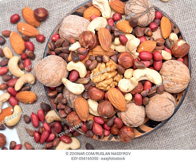 Assorted nuts in a wooden bowl