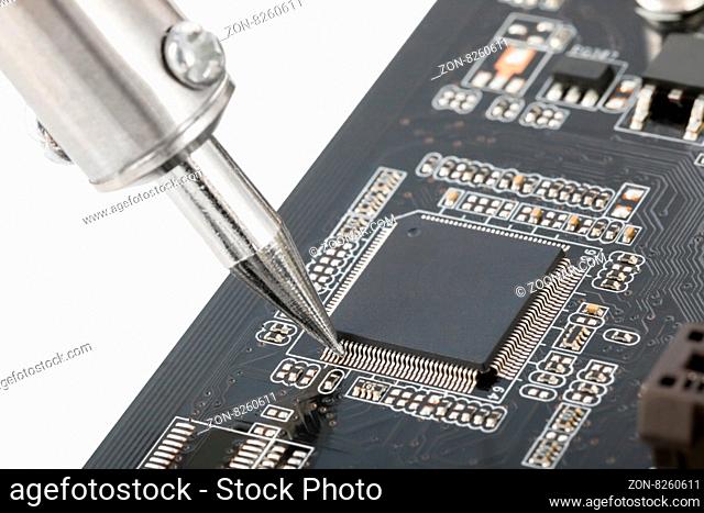 Microcircuit fixed with soldering iron - sharp photo