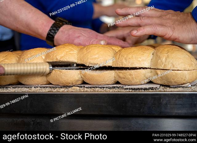 29 October 2023, Mecklenburg-Western Pomerania, Heringsdorf: World record - largest Bismark herring roll is produced in the store of fish sommelier and...