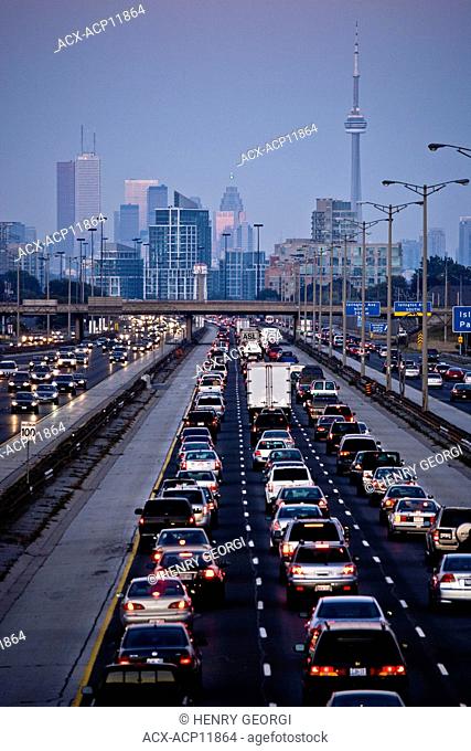 Rush-hour traffic on QEW Queen Elizabeth Way and Toronto city skyline, Toronto, Ontario, Canada