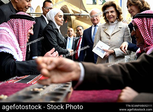 H.M King Carl XVI Gustaf and H.M. Queen Silvia watch as men play board games during a visit to the ancient city As-Salt, Jordan, November 16, 2022