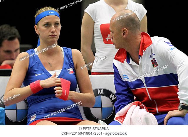 Czech tennis player Petra Kvitova (left) speaks with captain Petr Pala during the break in the semifinal Czech Republic vs