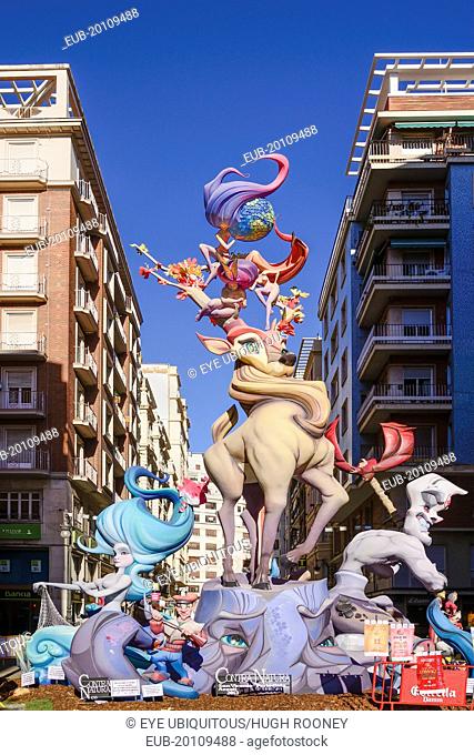 Typical falla scene with Papier Mache figures in the street during Las Fallas festival