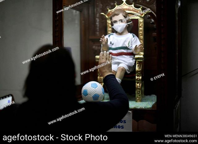 A faithful attends the Metropolitan Cathedral to pray to the holy 'Child of Miracles' so that the Mexican soccer team achieves a good result in the match...