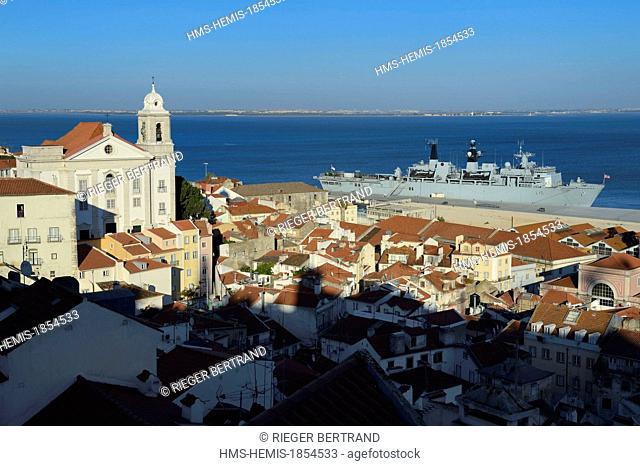 Portugal, Lisbon, view over the roofs of Alfama district, St Etienne church (Santo Estevao) and the Tagus from the Largo das Portas do Sol terrace