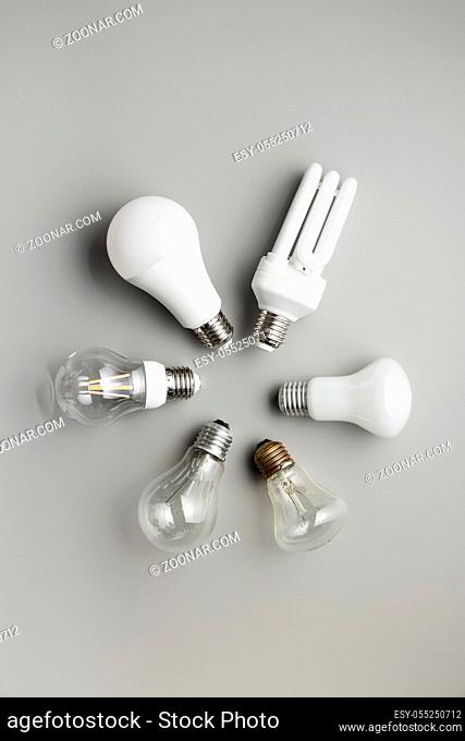 Energy saving and classic light bulbs on gray background. Top view