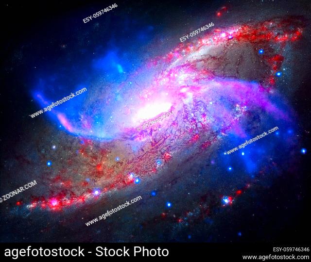 Spiral galaxy M106. It located in the constellation Canes Venatici. NGC 4258 is a spiral galaxy like the Milky Way. Retouched colored image