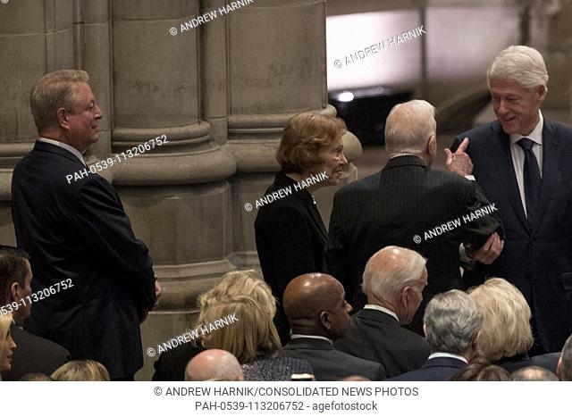 Former Vice President Al Gore, left, looks on as former President Jimmy Carter, second from right, and former first lady Rosalynn Carter, third from right