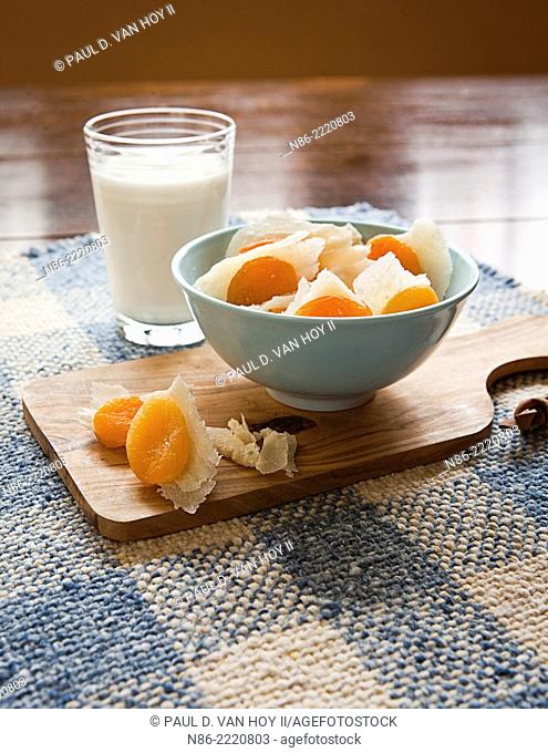 stuffed apricots with parmesan and a glass of milk - healthy snack