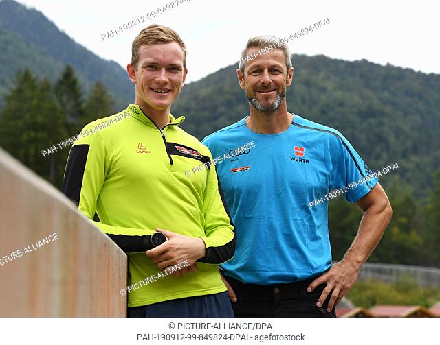 12 September 2019, Bavaria, Ruhpolding: Biathlete Benedikt Doll (l) and national biathlon coach Mark Kirchner look into the camera at the German Ski...