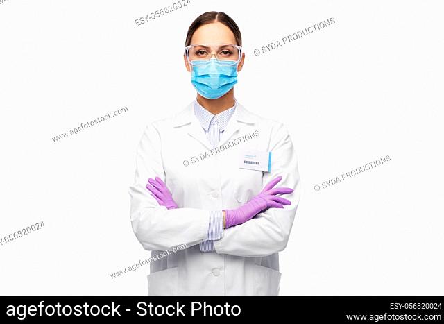 female scientist in medical mask and goggles
