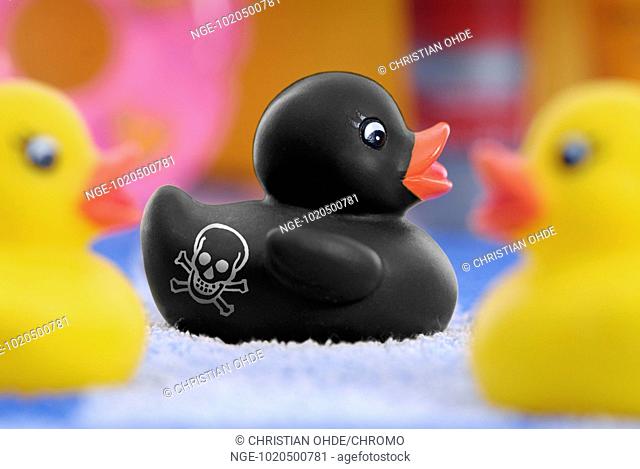 Black rubber duck labeled with skull, polycyclic aromatic hydrocarbons