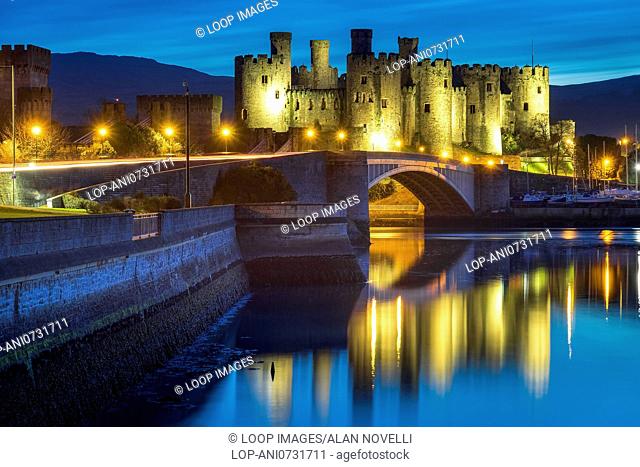 Conwy castle floodlit above the Conwy estuary at night