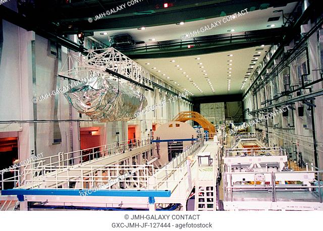 KENNEDY SPACE CENTER, Fla. -- In the Operations and Checkout Bldg. (OC), an overhead crane moves the S0 truss segment toward a workstand