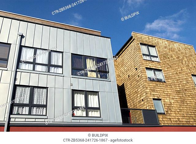 zinc sheet and cedar shingle cladding on a modern mixed-use development, London, UK