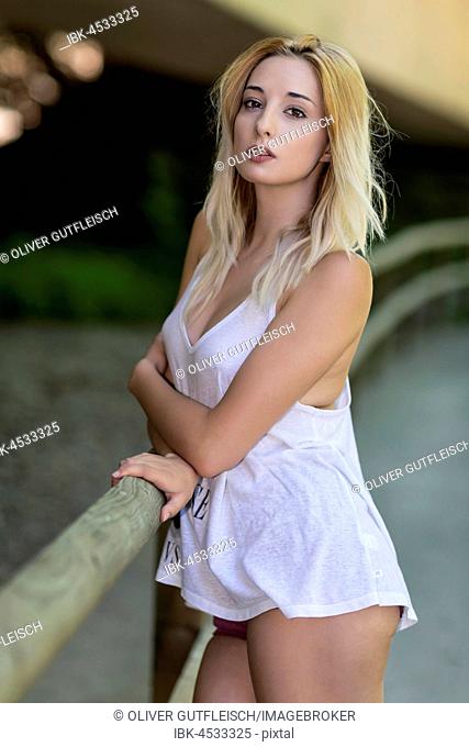 Young woman blond in white shirt