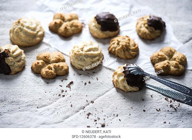 Vegan coconut biscuits, partly dipped with chocolate