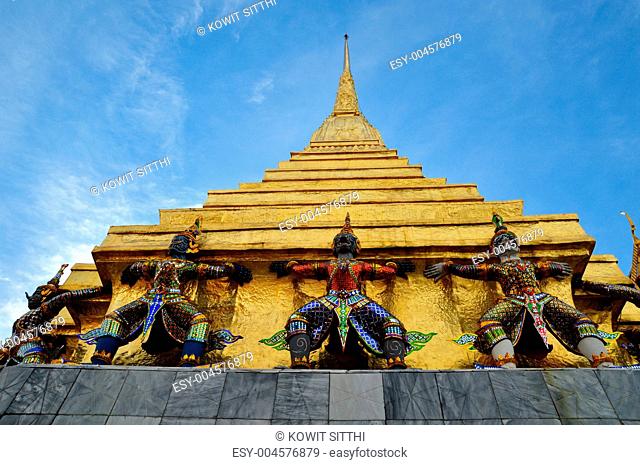 Giant Garuda statue and golden pagoda