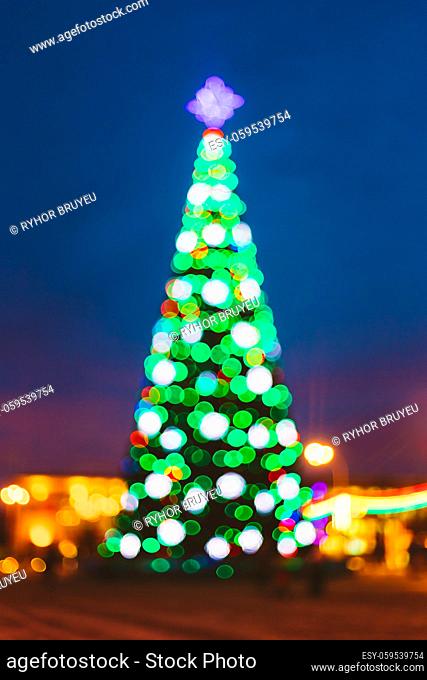 New Year Boke Lights Xmas Christmas Tree And Festive Illumination. Defocused Blue Bokeh Background Effect. Design Backdrop