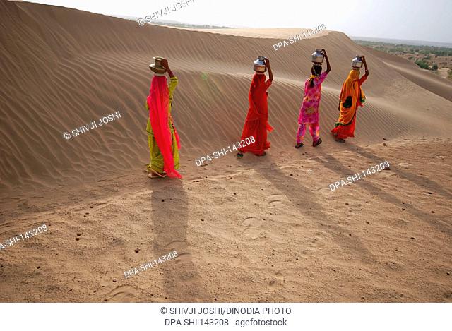 Girls in search of water ; Khuhri ; Jaisalmer ; Rajasthan ; India