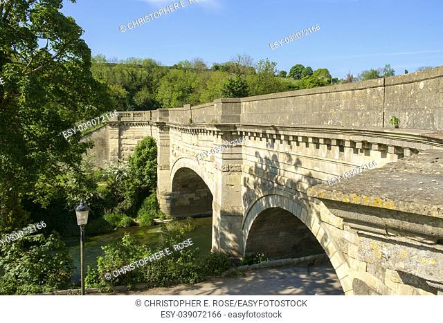 Historic Avoncliff Aqueduct carries the Kennet and Avon Canal over the River Avon and the Bath to Westbury railway line, at Avoncliff in Wiltshire, England
