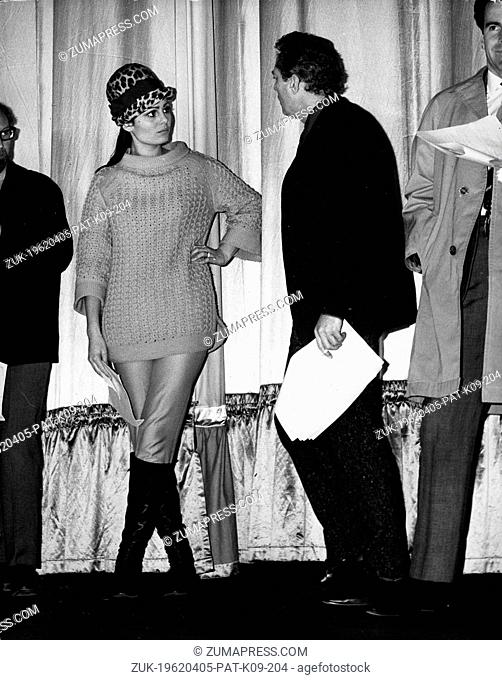 Feb. 14, 1965 - London, England, U.K. - Actress DALIAH LAVI chats with actor PETER FINCH on stage at the Odeon during rehearsal for the Royal Variety...
