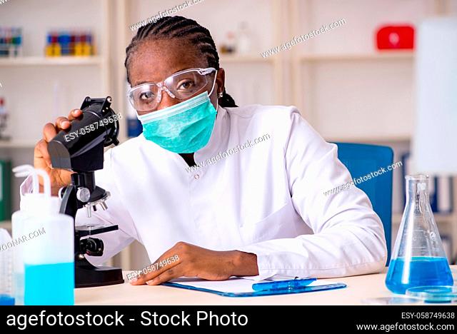 Young black chemist working in the lab