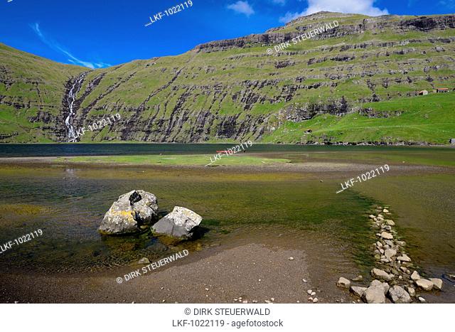 Waterfall and lake in Saksun, Streymoy Island, Faroe Islands