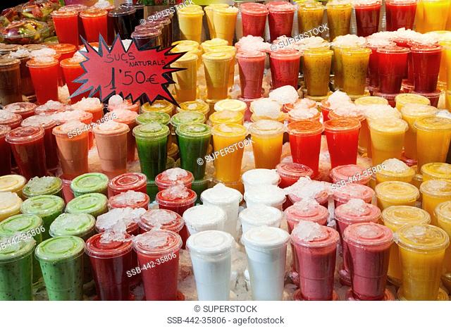 Fruit juice stall display, La Boqueria, La Rambla, Barcelona, Catalonia, Spain