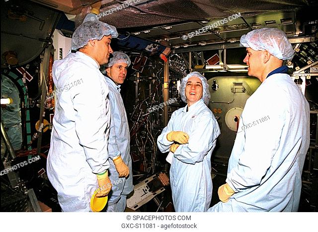 12/05/1997 --- STS-88 crew members and Boeing Manufacturing Engineer Harry Feinberg enjoy a moment inside Node 1 of the International Space Station ISS during...