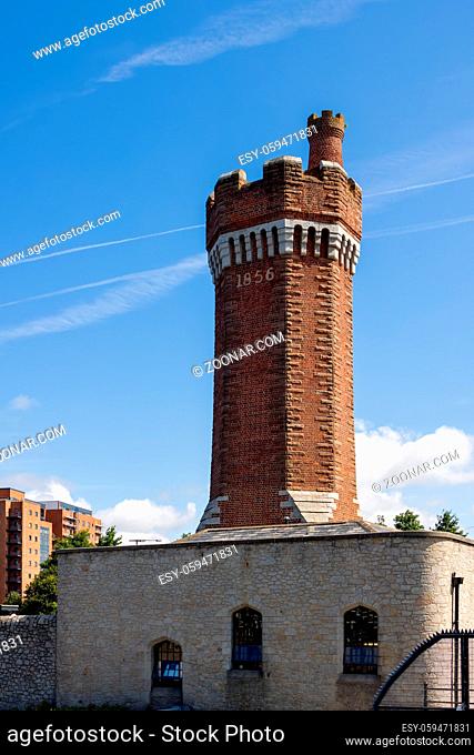 LIVERPOOL, UK - JULY 14 : View of the Brick Hydraulic Tower built in 1856 at Wapping Dock, Liverpool, England on July 14, 2021