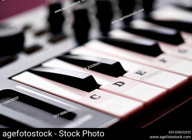 Close up image midi electronic musical keyboard, modern device, horizontal image selective focus, no people