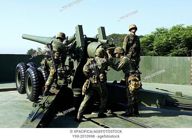 The Taiwan Military soldiers performing positional and firing drills on a US made, 1930's designed M1 155mm Long Tom howitzer