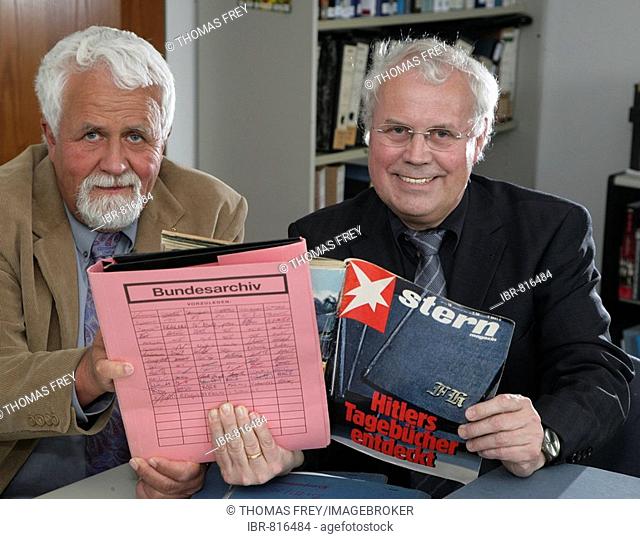 Archivists Klaus Oldenhage, left, and Josef Henke of the Federal Archive of Germany in Koblenz, pictured with an edition of Stern Magazine about the alleged...