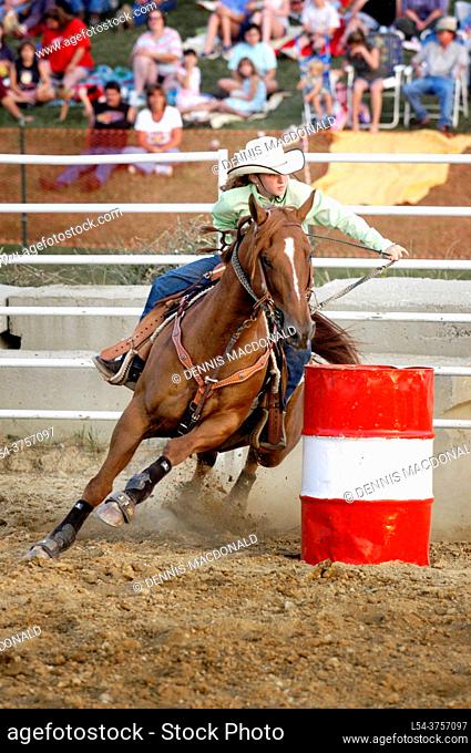 Female cowboy Compete in Rodeo Barrell Competition