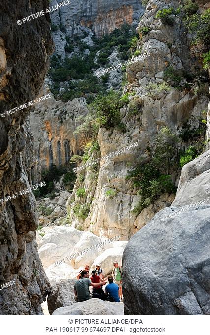 06 June 2019, Italy, Nuoro: The entrance to Gola Gorropu, a gorge in the Supramonte Mountains of the island of Sardinia. It is one of the deepest gorges in...