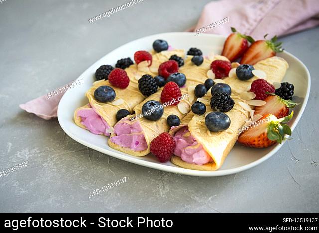 Protein crepes with pink papaya cream and berries