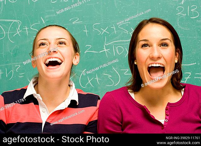 Two female students showing surprise