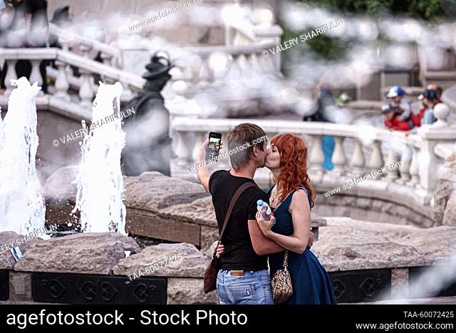 RUSSIA, MOSCOW - JUNE 25, 2023: People make a selfie in Manezhnaya Square. Valery Sharifulin/TASS