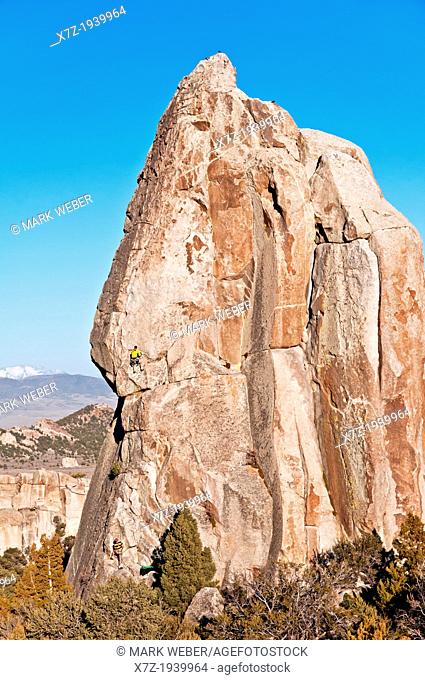Rock climbing a route called Skyline which is rated 5, 8 and located on Morning Glory Spire at the City Of Rocks National Reserve near the town of Almo in...