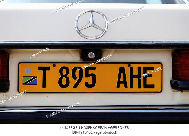 Yellow Tanzanian license plate on an old Mercedes in Tanzania, East Africa, Africa