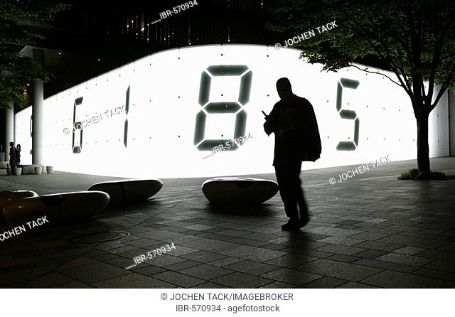 Japan, Tokyo: Roppongi Hills, light installation at the TV Asahi Headquarters. Big digital numbers, always changing