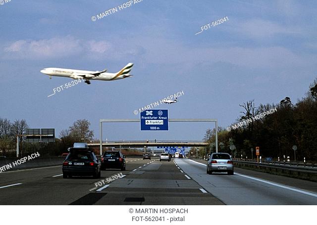 Aeroplanes flying over a motorway in Germany