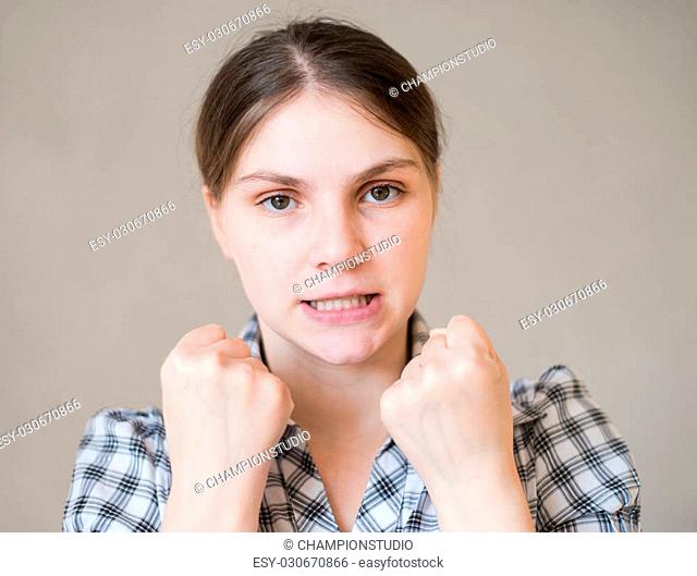 aggressive young woman showing her fist