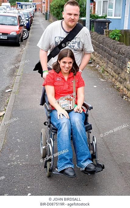 Young woman with Cerebral Palsy in a wheelchair with her boyfriend